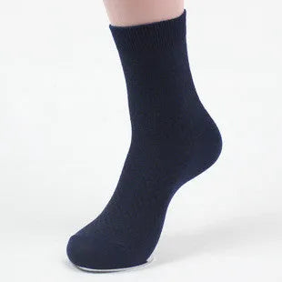 Men's bamboo fibre socks in black, navy, silver, iron grey, and grey blue with small square pattern.