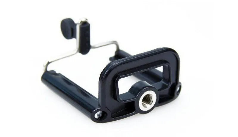 Mini aluminium tripod extended with ball head, shown alongside a U-shaped smartphone clip on a table.