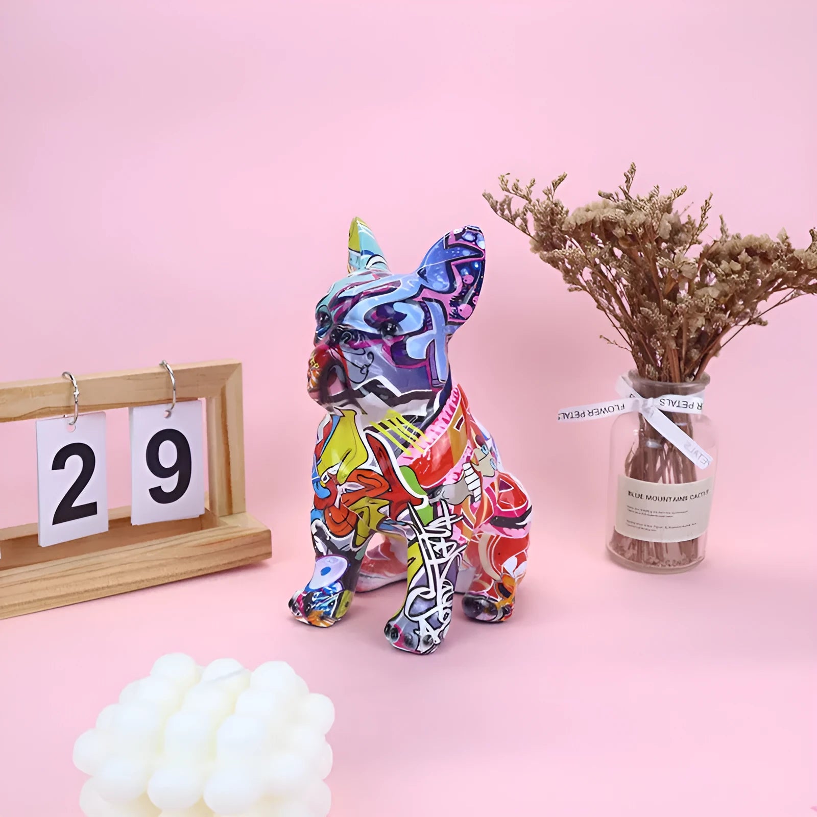 Graffiti finish resin French bulldog statue measuring 17cm in height on display surface