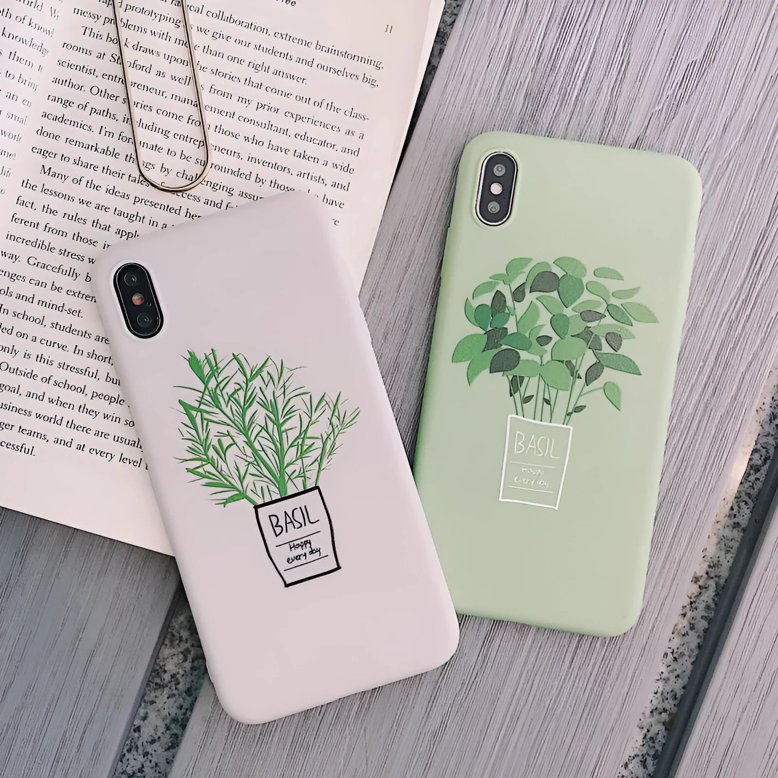 White silicone iPhone case with a detailed painted plant pattern on the back.
