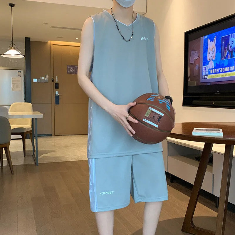 Polyester basketball sports suit with short sleeve vest and matching shorts in various colours