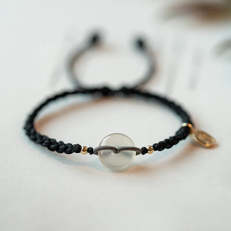 Woven crystal bracelet with flower motifs and ethnic design in black or double colour rope
