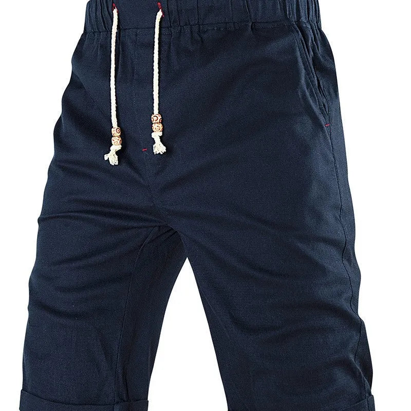 Men's solid-colour sports casual shorts with a drawstring waistband and a zippered side pocket.