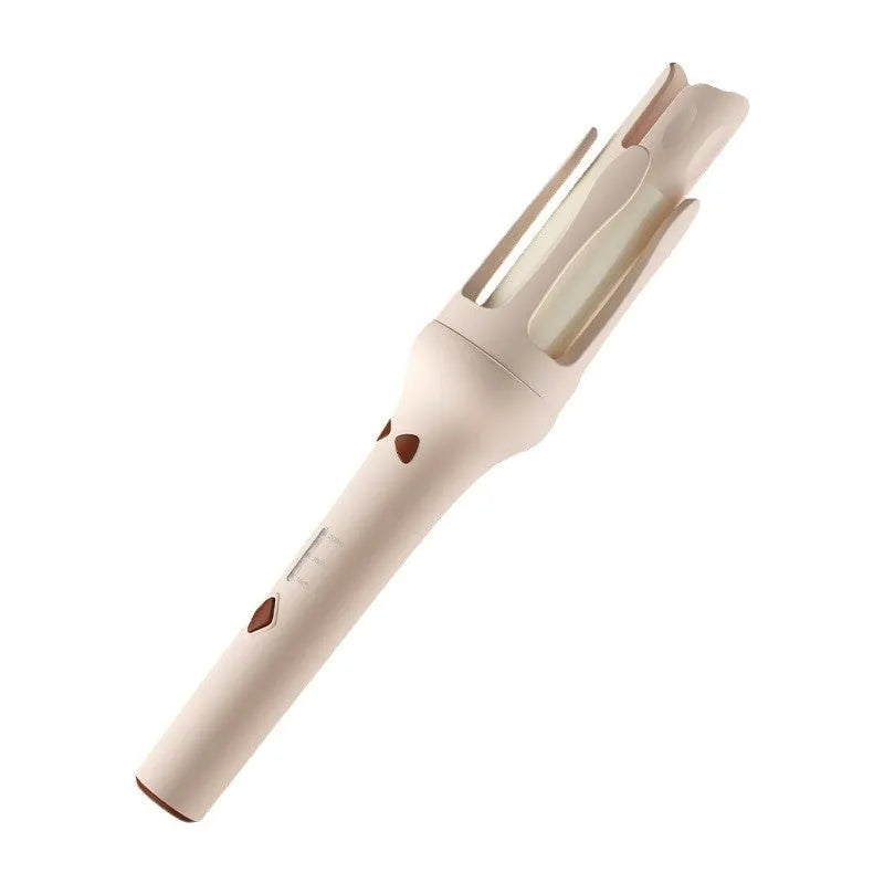 White and pink automatic hair curler with a 32mm rotating ceramic barrel and clamp, resting on a table with international power adapters.