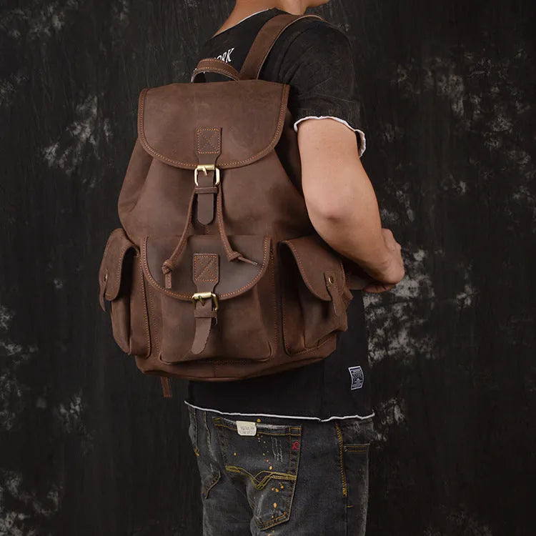 Men's leather drawstring backpack in first layer cowhide, retro style, 30cm x 15cm x 40cm, with curved shoulder strap and soft handle.