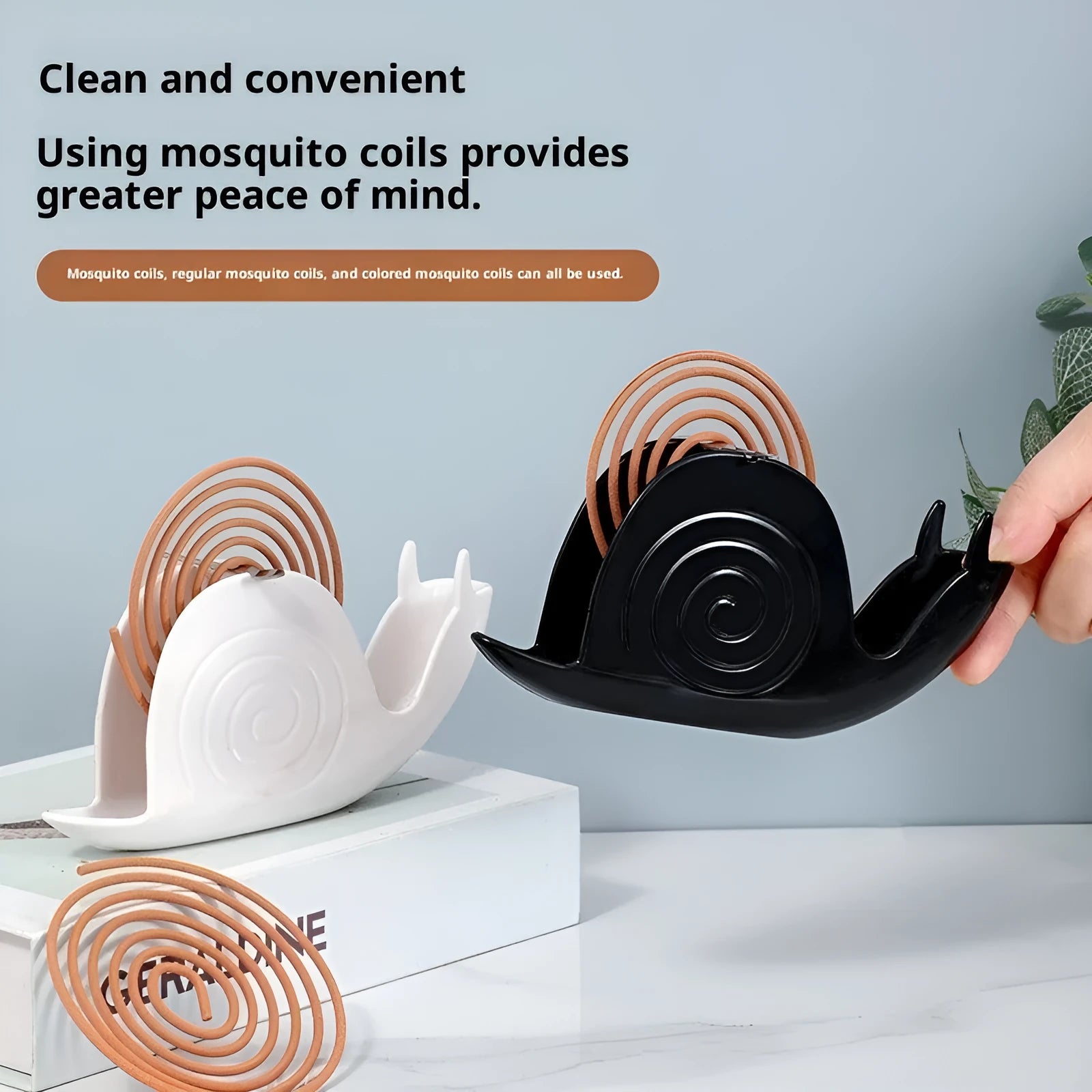 Black plastic universal mosquito incense holder on a table, simple portable design with creative animal style