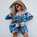 Sapphire blue women's plus-size bikini three-piece set on a neutral background.