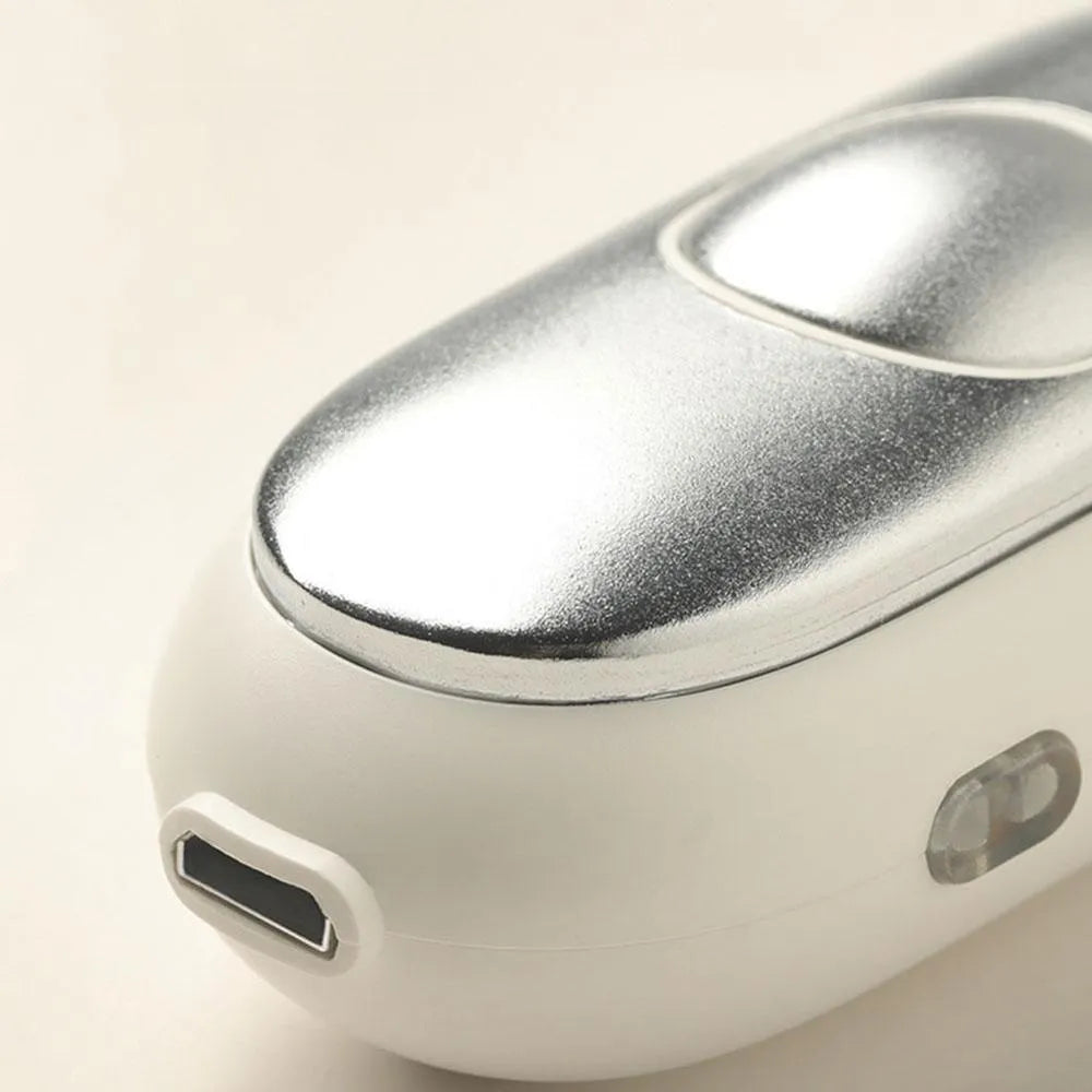 Handheld micro-current sleep aid device in grey colour with USB charging cable