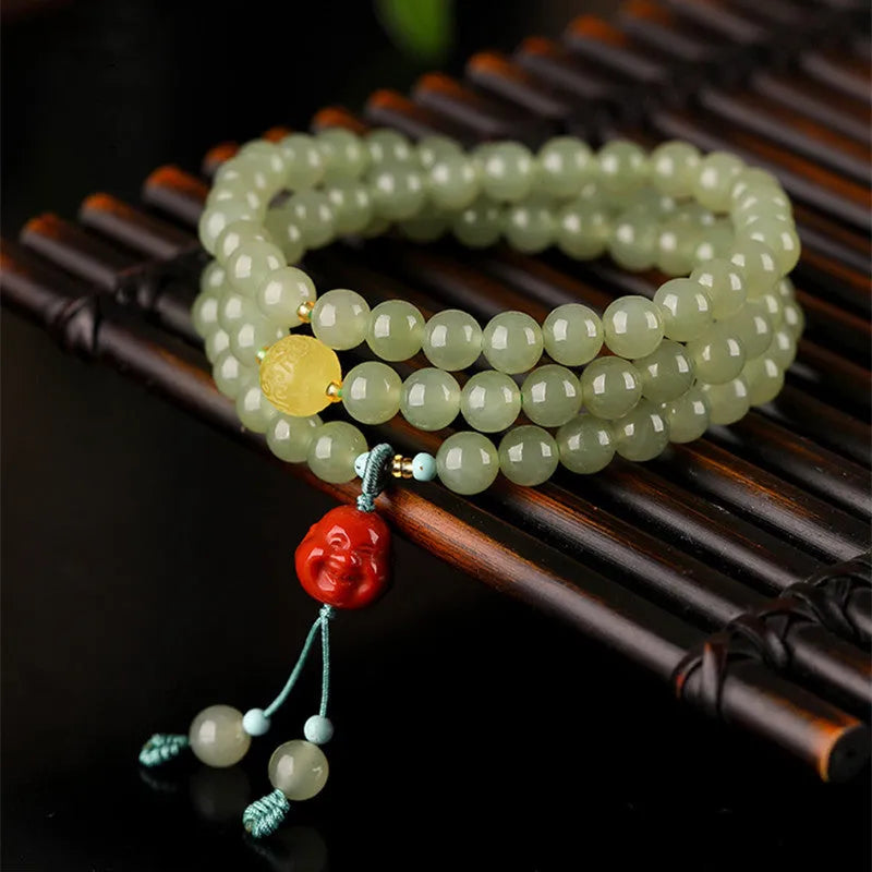 Pale blue Hetian jade bracelet with 6mm beads in three-circle design on wrist
