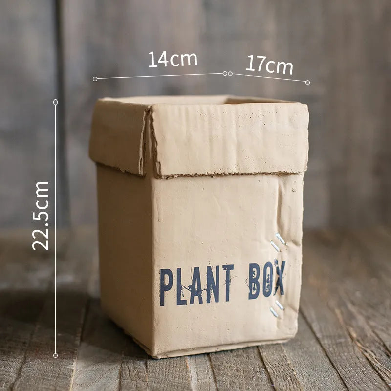 Cement brown paper box style flowerpot with drainage holes for indoor plants
