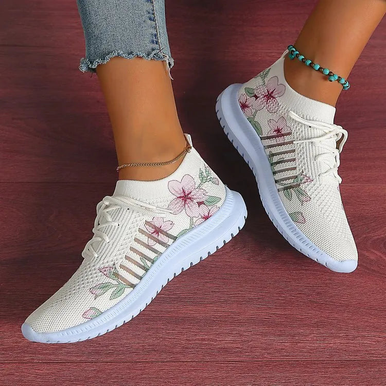 Women's Milky White mesh Flyknit running shoes with a round toe and flat rubber sole.