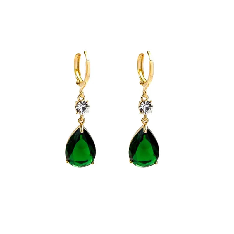 A pair of green geometric teardrop-shaped alloy fashion earrings on a plain background.