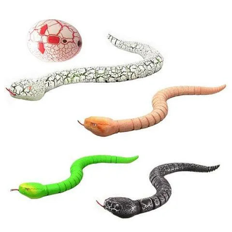Green remote control snake toy with retractable tongue and swinging tail on floor