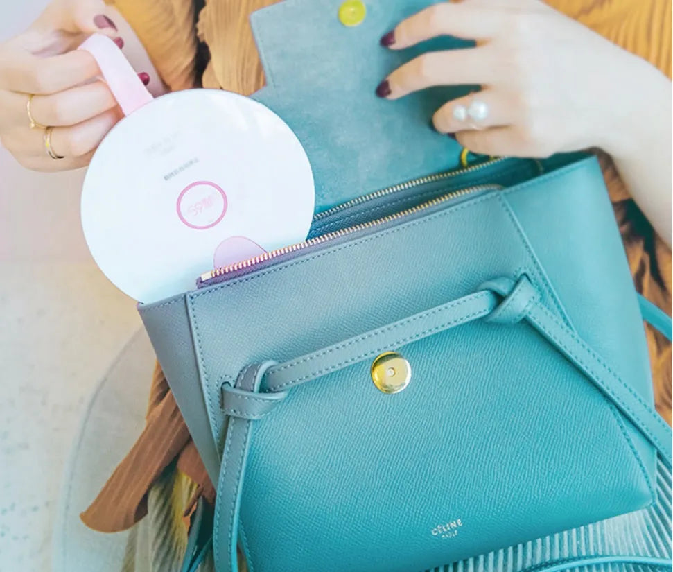 Portable baby bottle steriliser showing compact blue design with USB port and measuring 163.6mm long