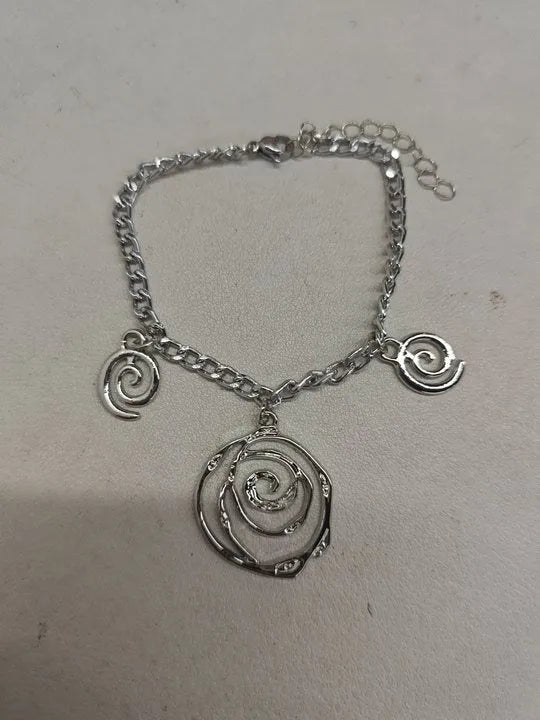 Spiral donut women's jewellery set showing necklace, bracelet, and earrings with geometry circle design