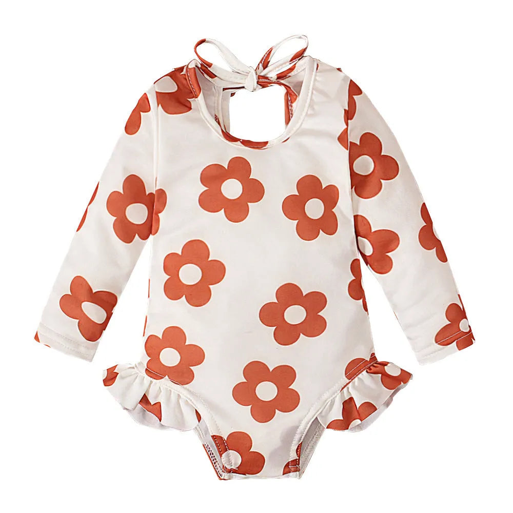 Girls floral print swimsuit with crew neck front and open back in orange colour