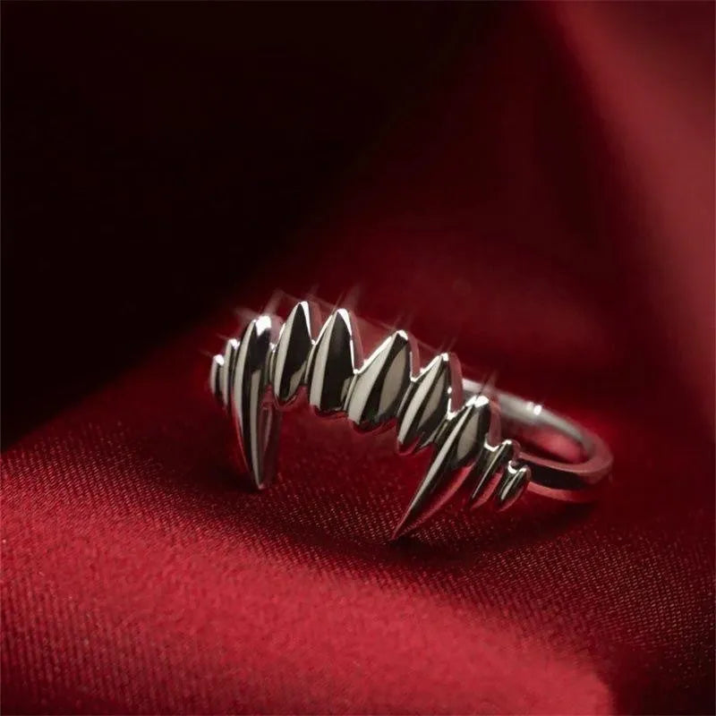Silver vampire split open ring on finger showing adjustable opening and zinc alloy construction