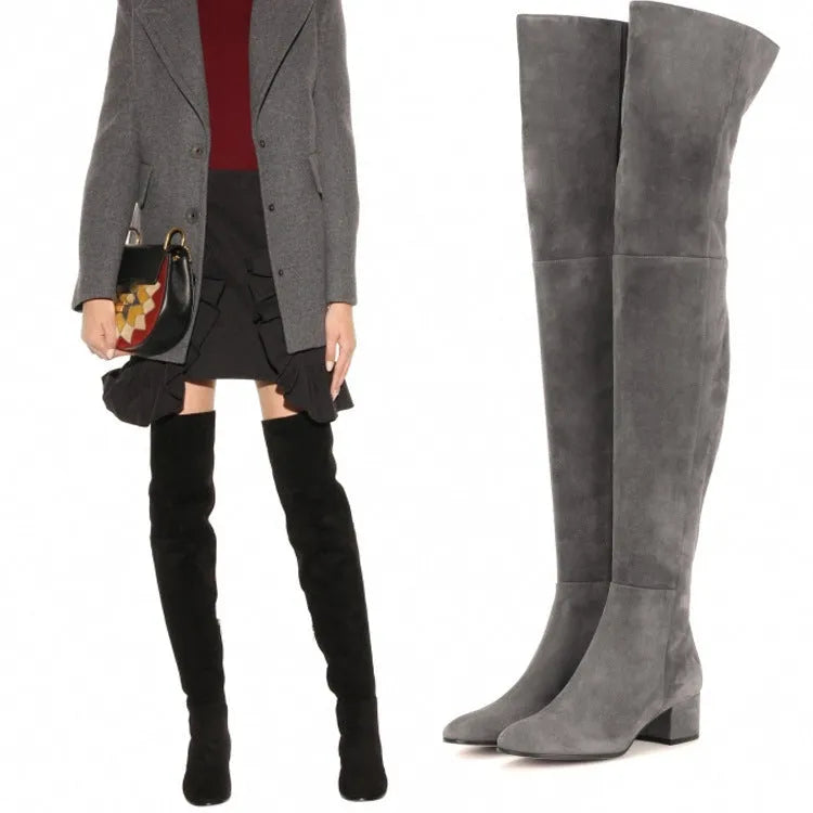 Grey suede women's flat over-the-knee boots with a pointed toe and low block heel on a white background.