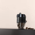 Coffee cup shaped solid car air freshener in black, brown, white, orange, or green.