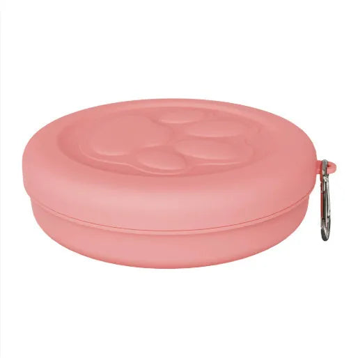 Collapsed and open views of a pink silicone dog bowl with matching sealing lid, next to a dog lead.