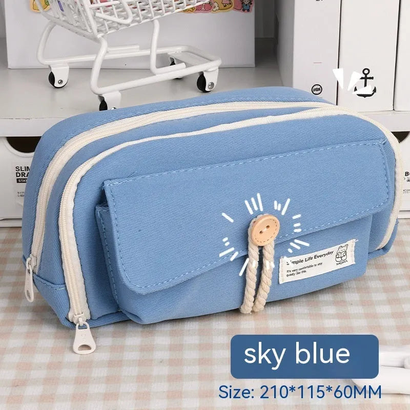 Green canvas pencil case with button closure, large capacity for pens.