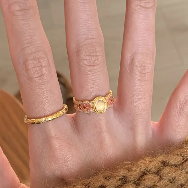 Open mouth geometric ring with pink crystal enamel accents on gold-plated copper band