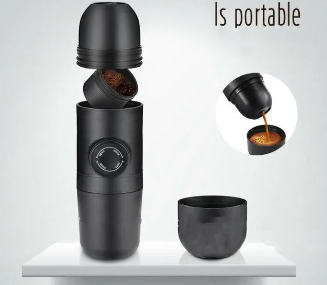 Black portable manual coffee machine measuring 6cm by 17.5cm on a table
