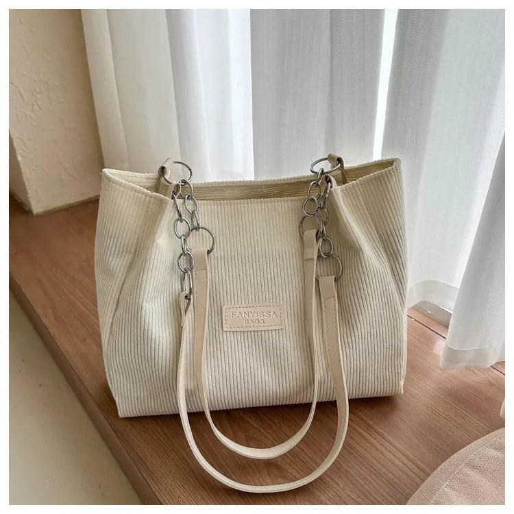 Corduroy one-shoulder tote handbag in black, white or brown with three-dimensional pocket