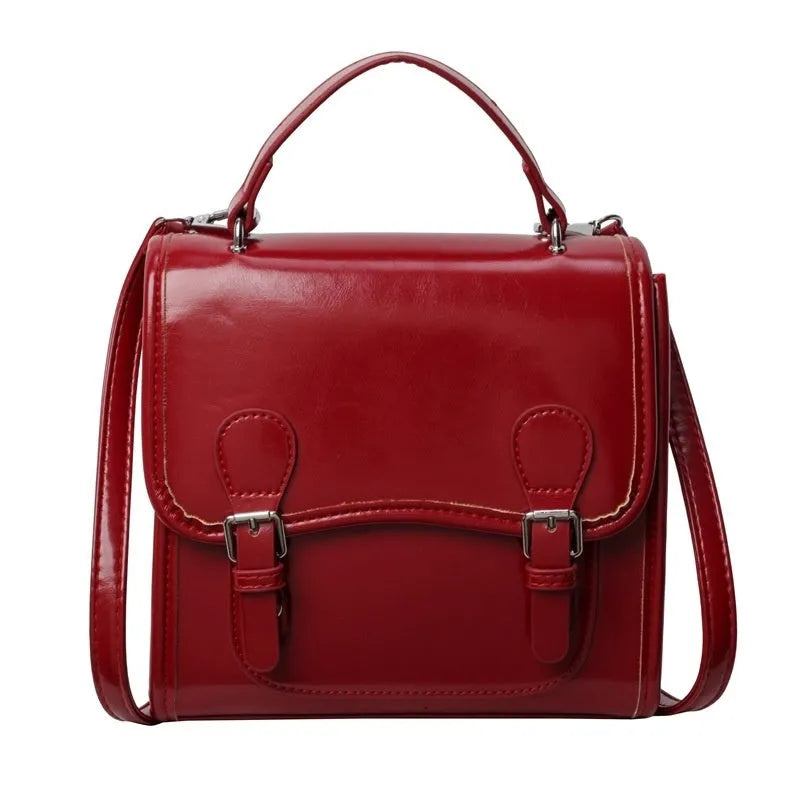 Simple PU college backpack in white, black, wine red, or silver with polyester lining and sewing thread detail