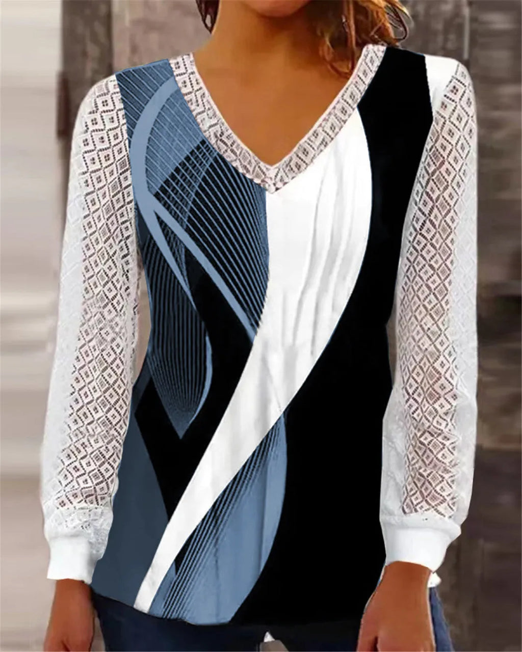Purple women's loose V-neck top with hollow-out lace detailing on a hanger.