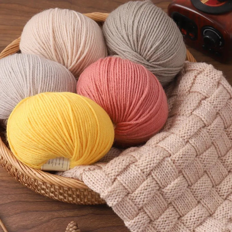 One skein of fine hand knitting wool thread in a choice of colours, shown next to UK size 10 knitting needles.