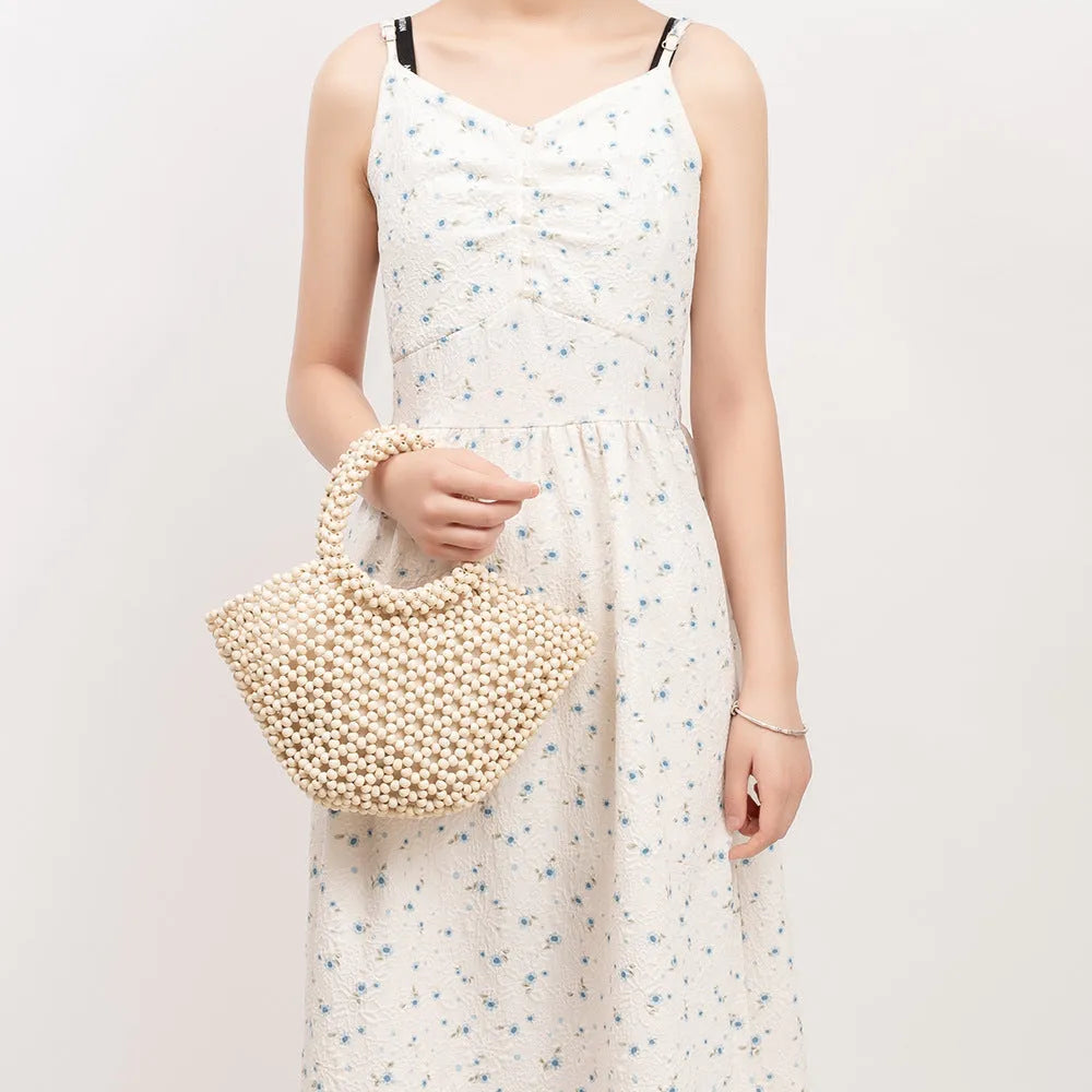Hand-woven maple hollow handbag with wooden bead decoration, dumpling-shaped 13x7x18cm beach bag