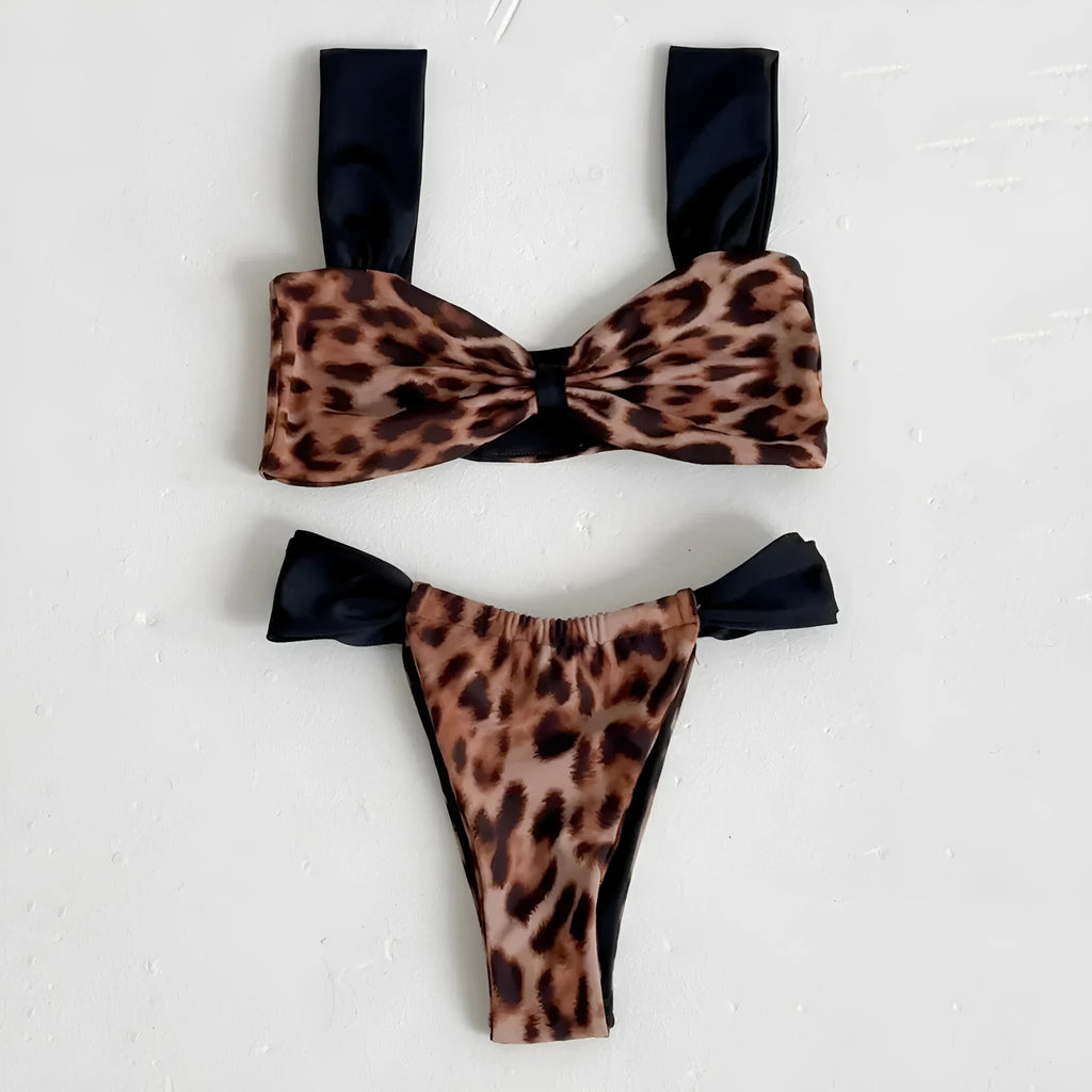 Women's leopard print bandeau bikini set with split top and T-pants bottoms.