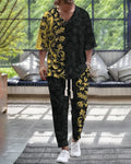 Lightweight cropped sleeve V-neck top and matching trousers suit in a solid colour.