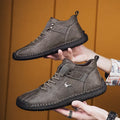 Men's casual sneakers in black with microfiber upper, rubber sole, lace-up front, and car stitching detail