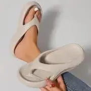 Women's thick-soled flip-flops in black, white and grey colours with non-slip EVA construction