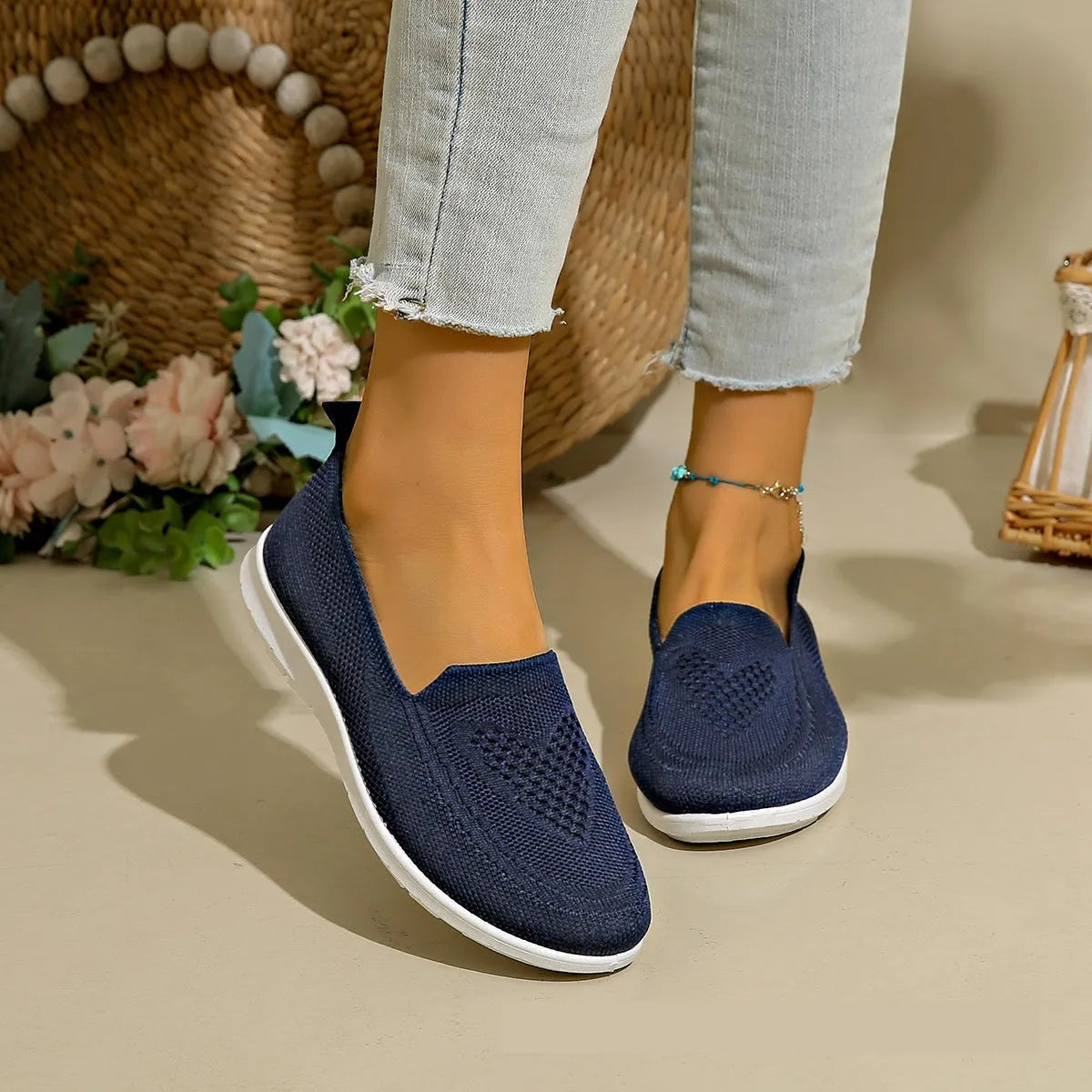 Women's plus size beige slip-on loafers with heart pattern and mesh lining.