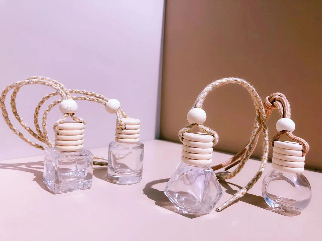 Glass car fragrance pendant showing Cylinder, Diamond, Flat Drum, and Square bottle style options.