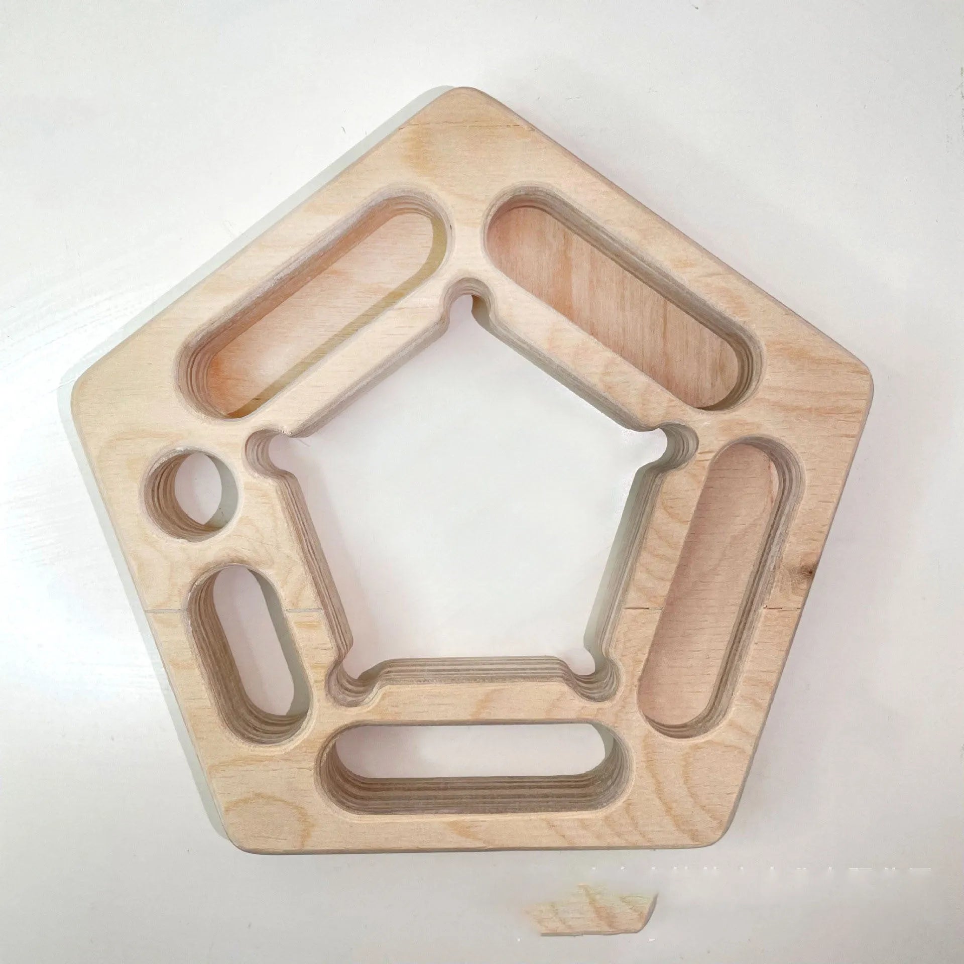 Wooden climbing training board with pentagonal round design for finger strength exercises