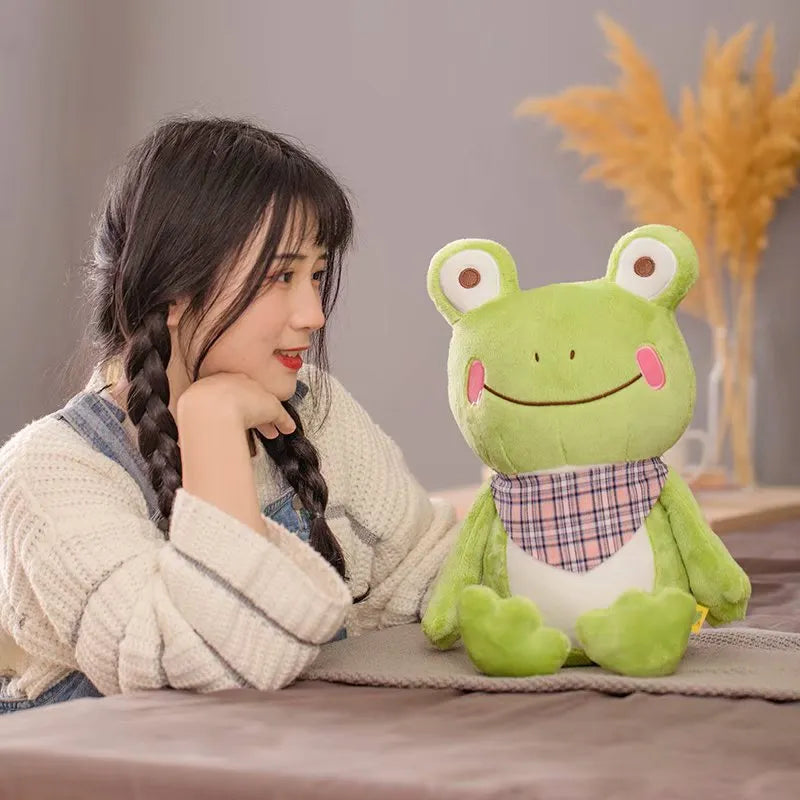 Cute scarf frog doll plush toy in blue with scarf, on a neutral background