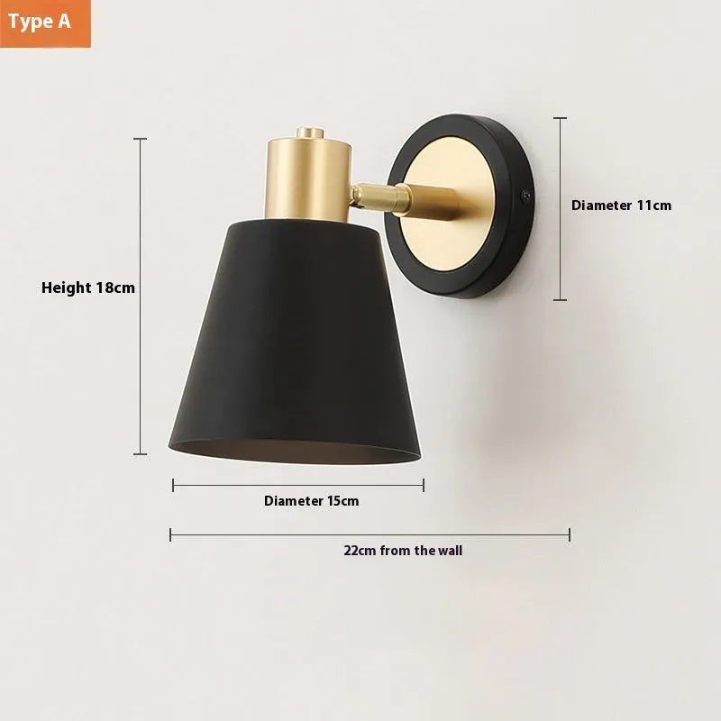 Nordic-style iron wall lamp mounted on a wall beside a bed.
