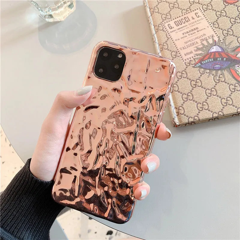 Electroplated rose gold TPU phone case for iPhone, showing precise camera and port cutouts.