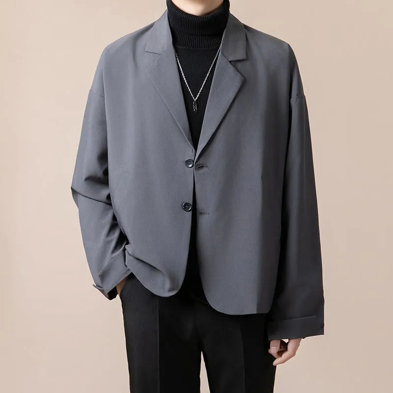 Men's loose fit casual suit jacket in light business style with long sleeves and regular length