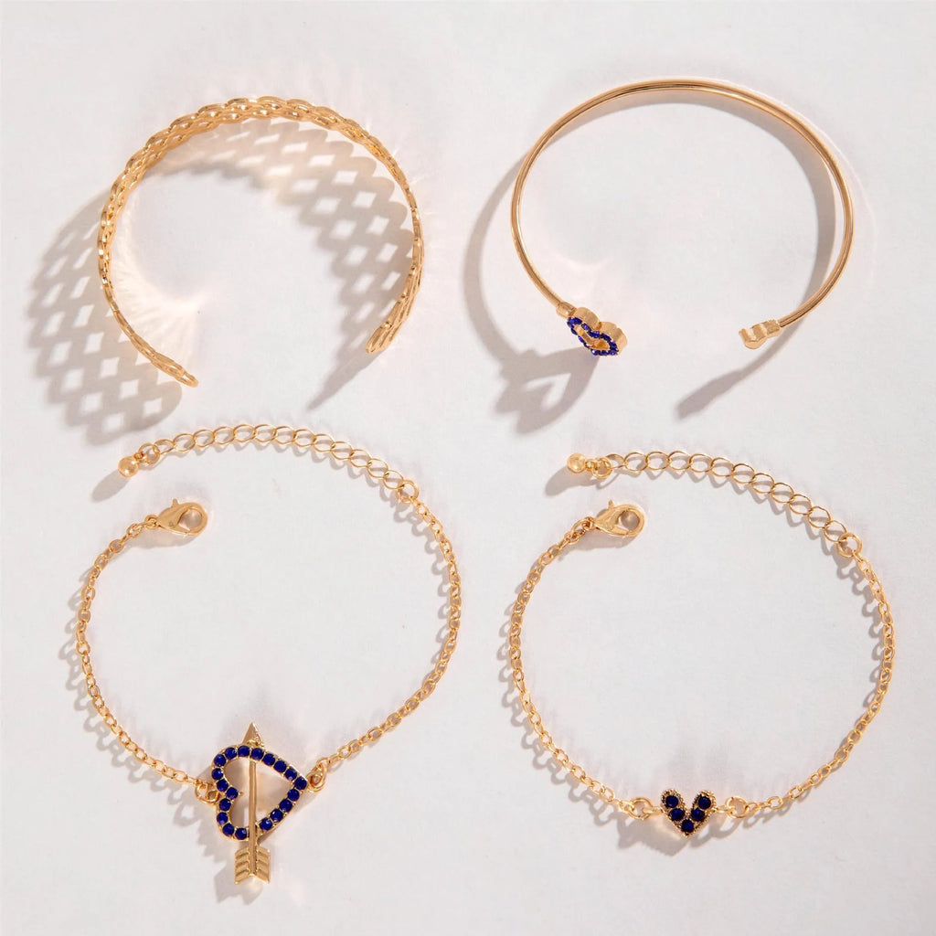 Four-piece blue and gold-tone bracelet set with heart, butterfly, and flower designs, rhinestone accents, alloy electroplated finish