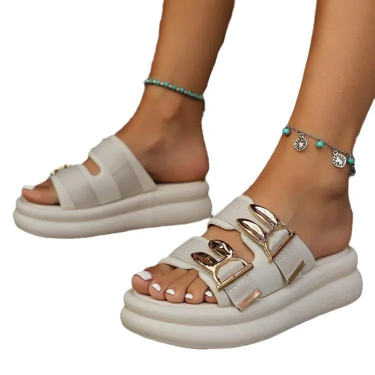 Women's apricot suede slippers with a thick, soft rubber sole on a light background.