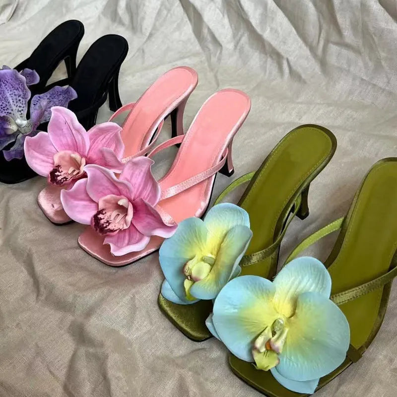 Pink women's sandals with satin uppers, artificial Phalaenopsis orchid decoration, and 3-6cm mid heel