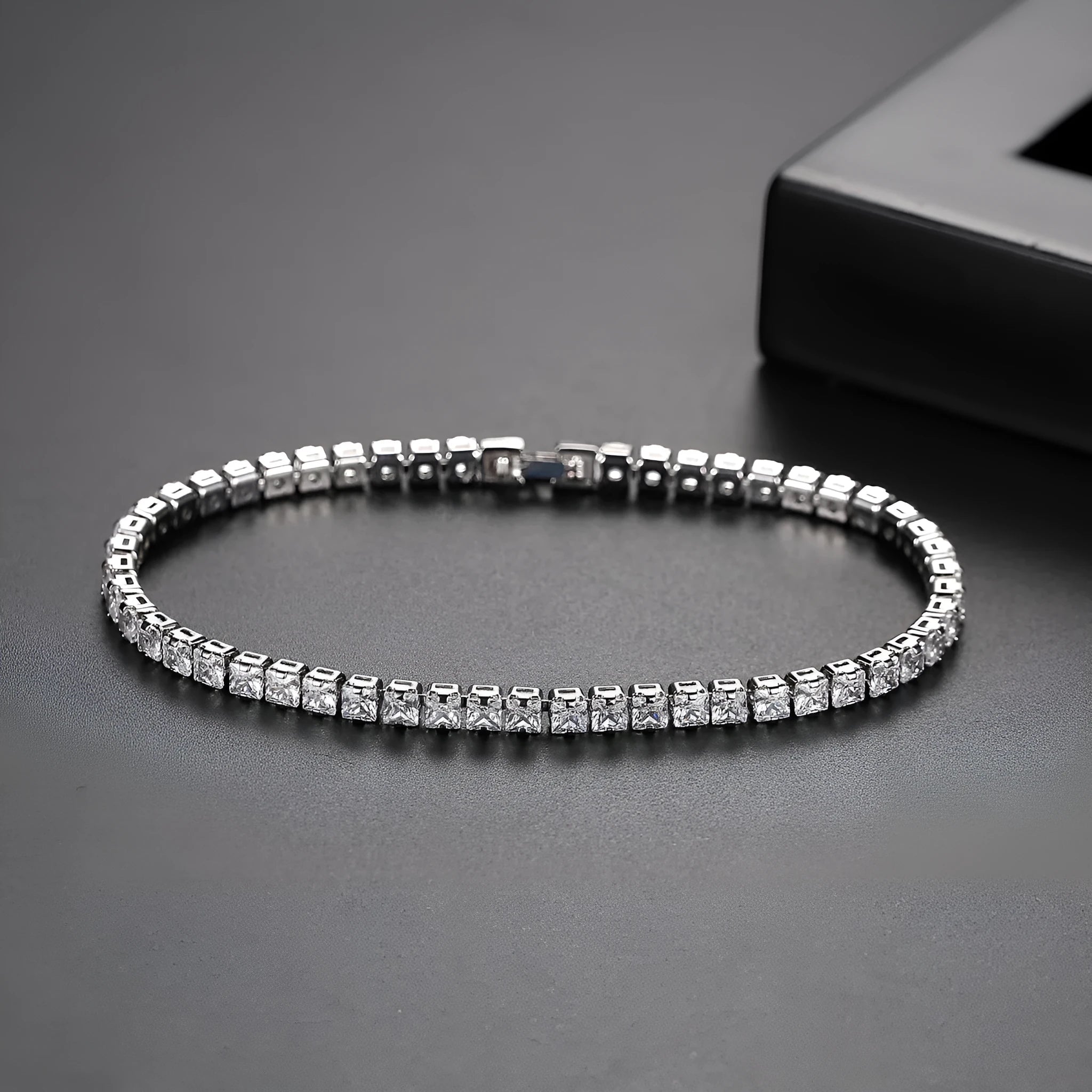 Women's copper tennis bracelet with geometric open-work design and cubic zirconia in gold finish on a light background