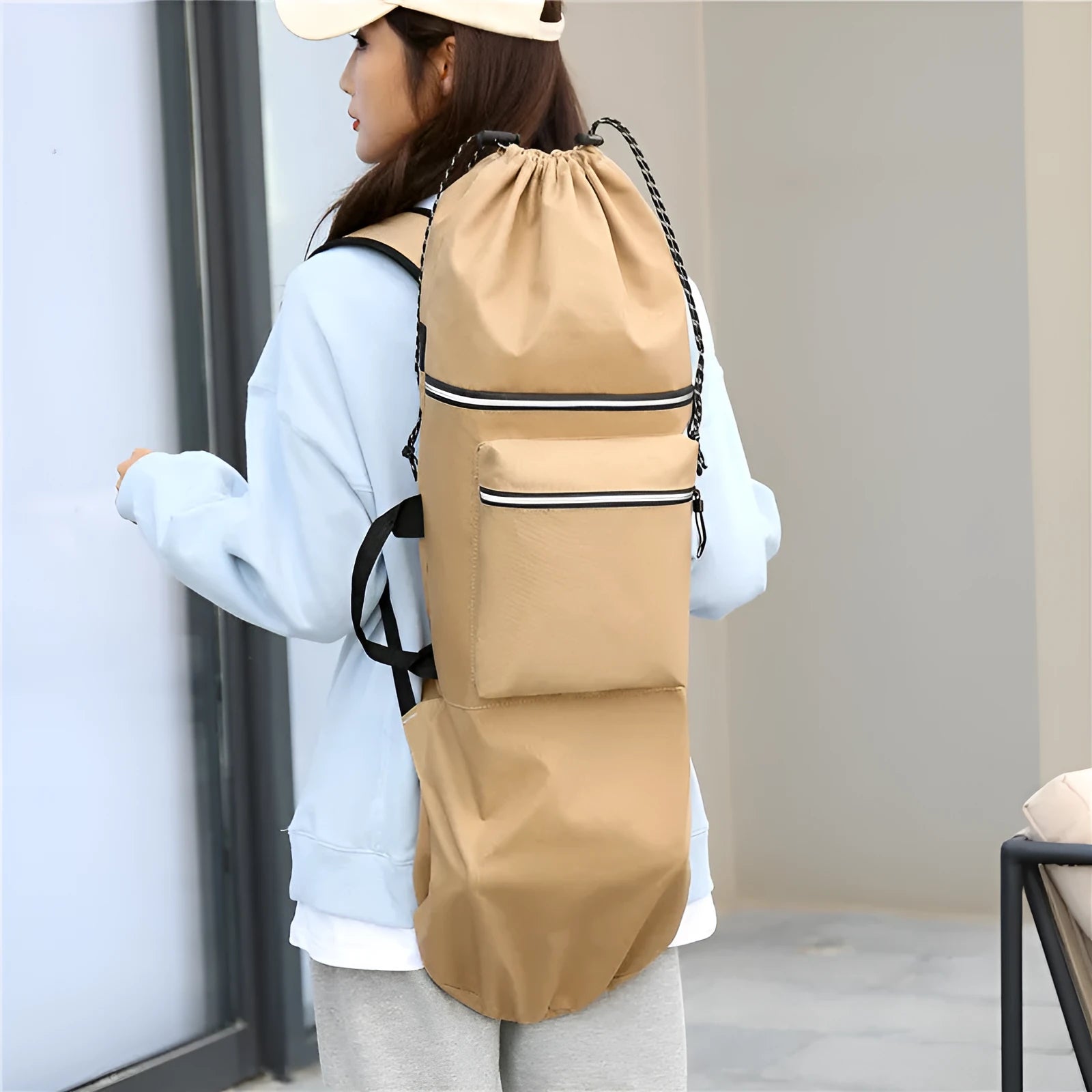 Black waterproof nylon skateboard bag with shoulder strap, showing 90cm length for longboards or fishing rods.