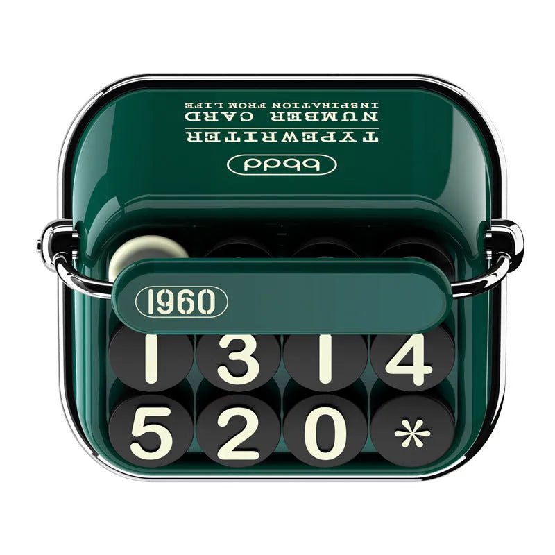 Creative typewriter-style temporary parking number plate in zinc alloy and ABS on a desk
