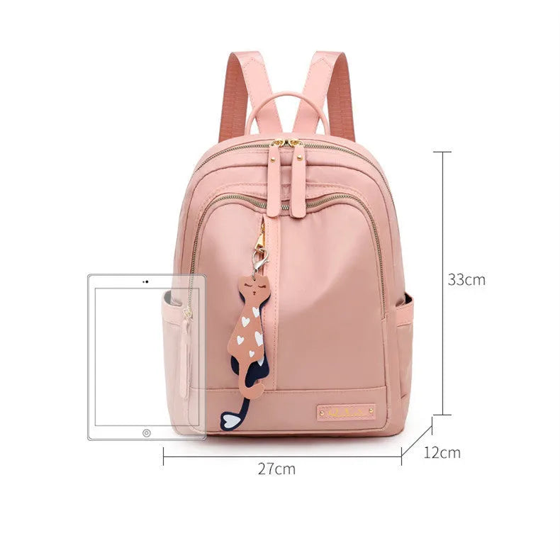 Black casual nylon backpack with shoulder straps, showing internal organiSation pockets and a soft handle.